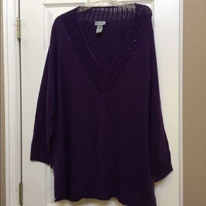 Rich purple, soft sweater with some sparkles.
